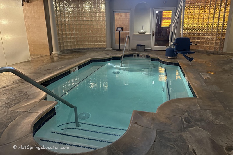 Fairmont Sonoma Mission Inn & Spa in California: The picture "Fairmont Sonoma Mission Inn & Spa in California indoor soaking pool" features a small, elegant indoor soaking pool with stairs leading into the water, surrounded by stone flooring and glass block walls.